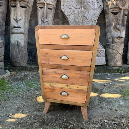 A rustic wooden chest of drawers with four drawers and metallic half-moon handles for home decor use