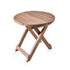 A round light brown wooden folding coffee table made of recycled teak wood with a rustic finish and visible grain