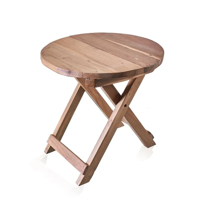 A round light brown wooden folding coffee table made of recycled teak wood with a rustic finish and visible grain