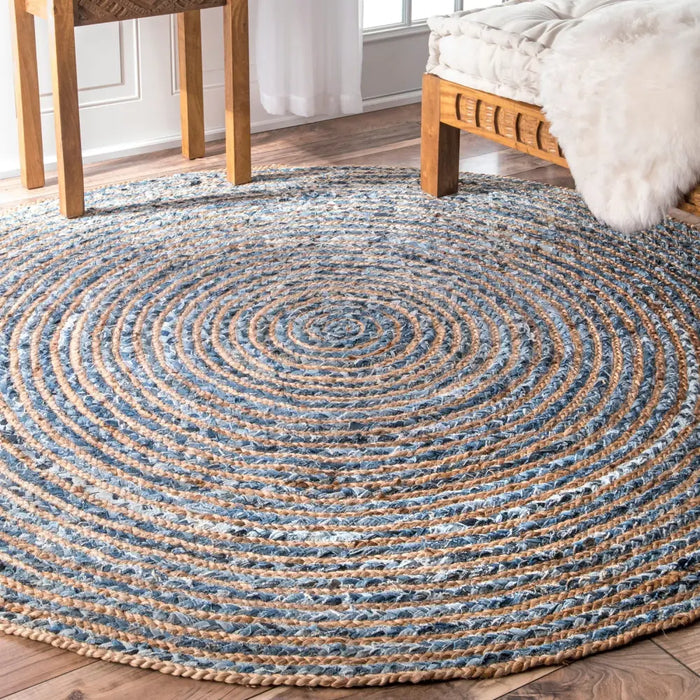 Round jute and recycle denim rug with 150cm diameter featuring concentric blue and beige woven rings