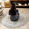 Round woven jute and recycled denim rug with concentric gray beige and white rings 150cm diameter