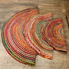 Round jute and recycled cotton rug with vibrant multicolored concentric stripes in 120cm size