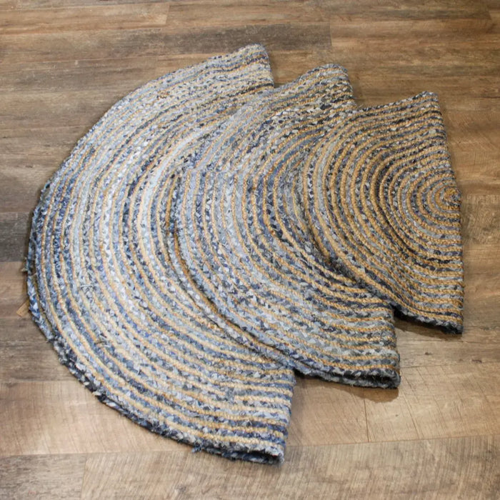 Handwoven semi-circular 90cm rug with concentric rings of natural jute and gray recycled denim fibers
