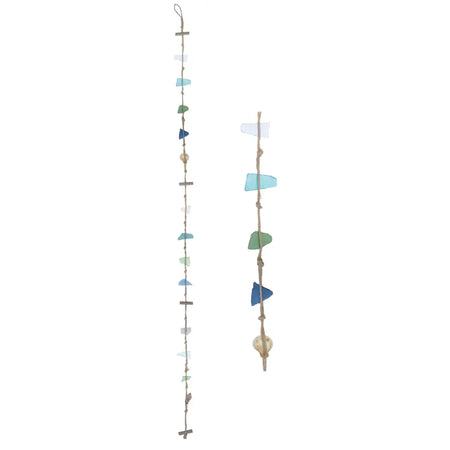 Two rustic sea glass hanging mobiles with blue and green sea glass, shells, and driftwood pieces on strings