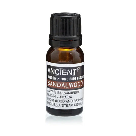 A small amber glass bottle with black cap labeled ancient wisdom 10ml pure sandalwood amyris balsamifera oil