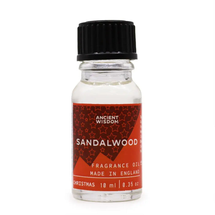 A clear glass bottle with black ribbed cap and red star label of ancient wisdom sandalwood fragrance oil 10ml