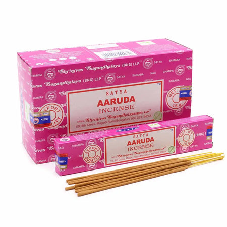 Pink cardboard box of satya incense sticks aaruda showing packaging design and product branding details