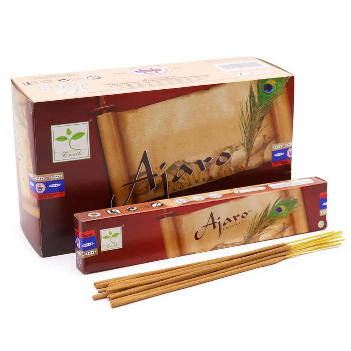 Satya incense sticks ajaro in a reddish brown box with peacock feather design and light brown wooden textured sticks