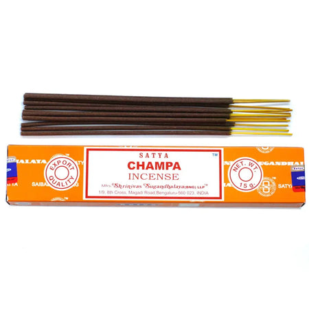 A box of satya incense sticks champa with brown sticks and golden tips in orange packaging design