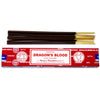 A box of satya incense sticks dragon blood with dark brown sticks and golden tips in bright red packaging with white text