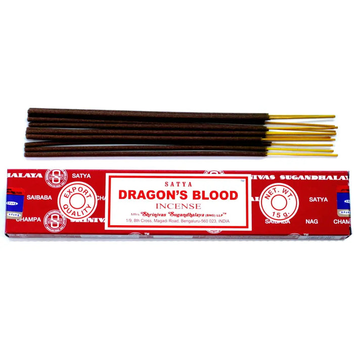 A box of satya incense sticks dragon blood with dark brown sticks and golden tips in bright red packaging with white text