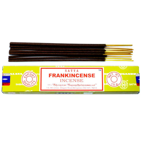 A box of satya incense sticks frankincense with bright yellow packaging and dark brown sticks with golden tips