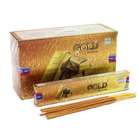 Satya incense sticks wrapped in gold foil inside a gold-colored box labeled gold incense for aromatic use