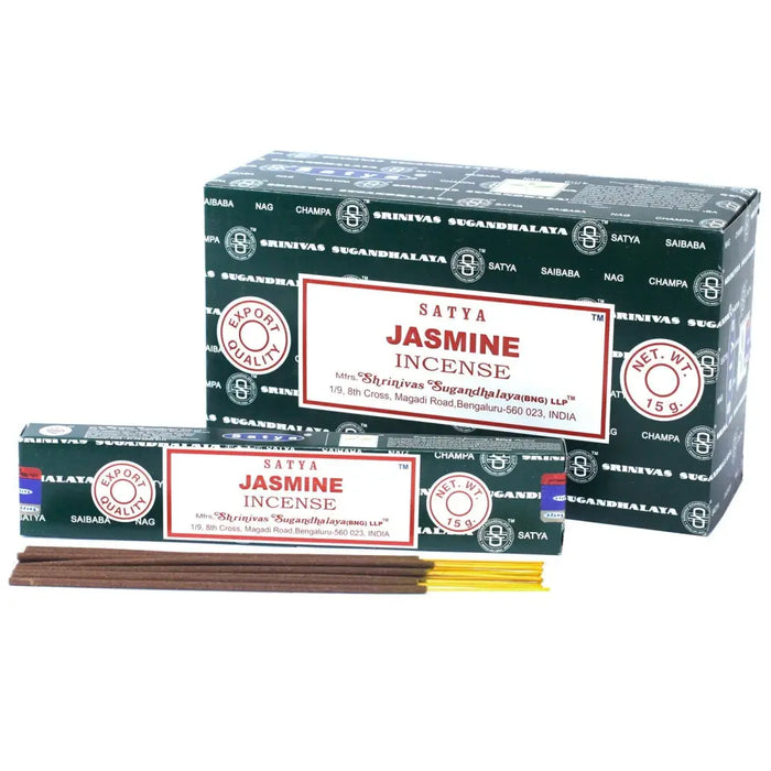 Dark brown satya incense sticks with yellow tips packaged in a green and white jasmine incense box