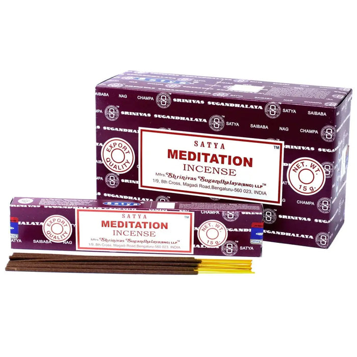 Purple and white packaged satya incense sticks with brown incense rods for meditation use