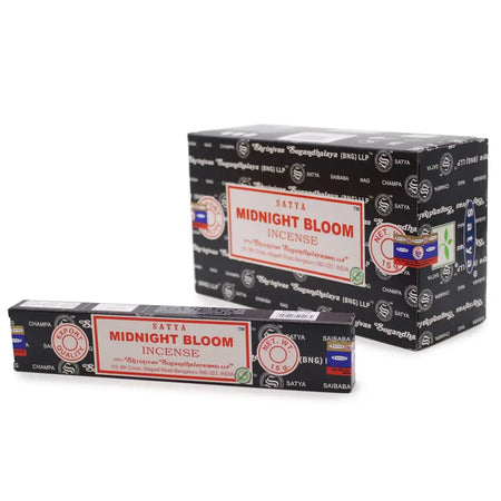 A black rectangular box of satya incense sticks with red and white labeling showing midnight blossom scent