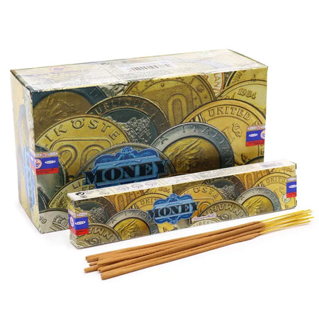 Golden satya incense sticks with money design packaging featuring images of coins and the brand name visible