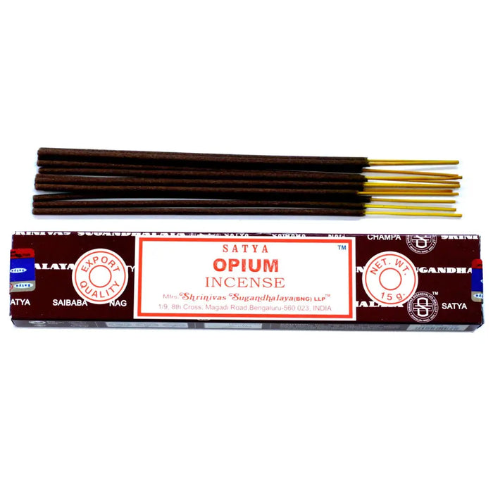 A pack of satya incense sticks with dark brown rods and golden tips in a maroon box labeled opium