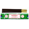 A box of satya incense sticks patchouli with dark brown wooden sticks and golden tips in green packaging