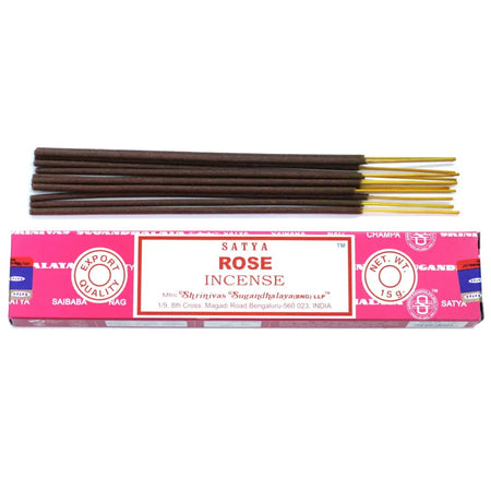 Pink-packaged satya incense sticks with rose scent featuring dark brown sticks and golden tips