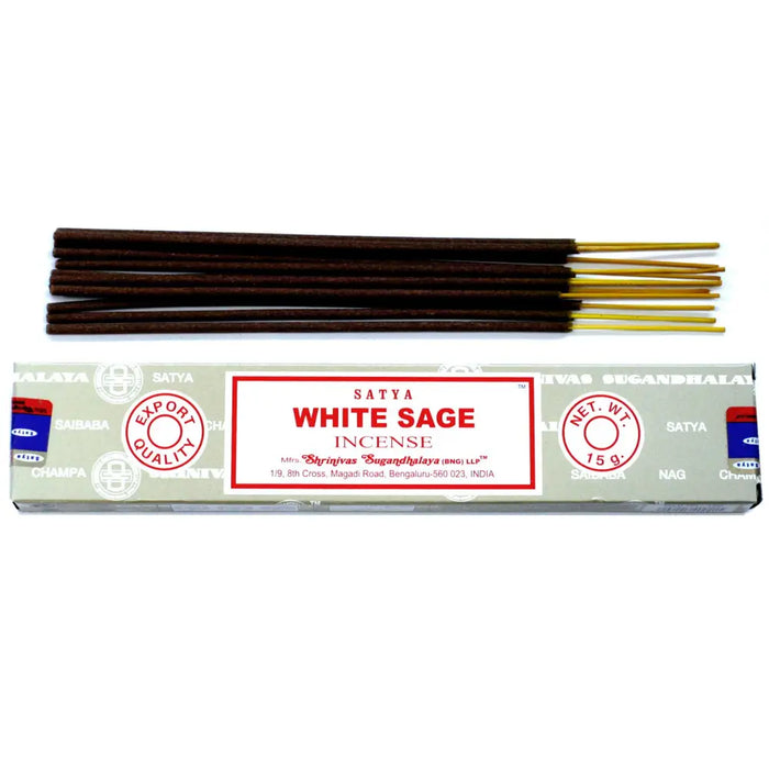 A box of satya incense sticks white sage with dark brown wooden sticks and golden tips in silver-gray packaging with red text