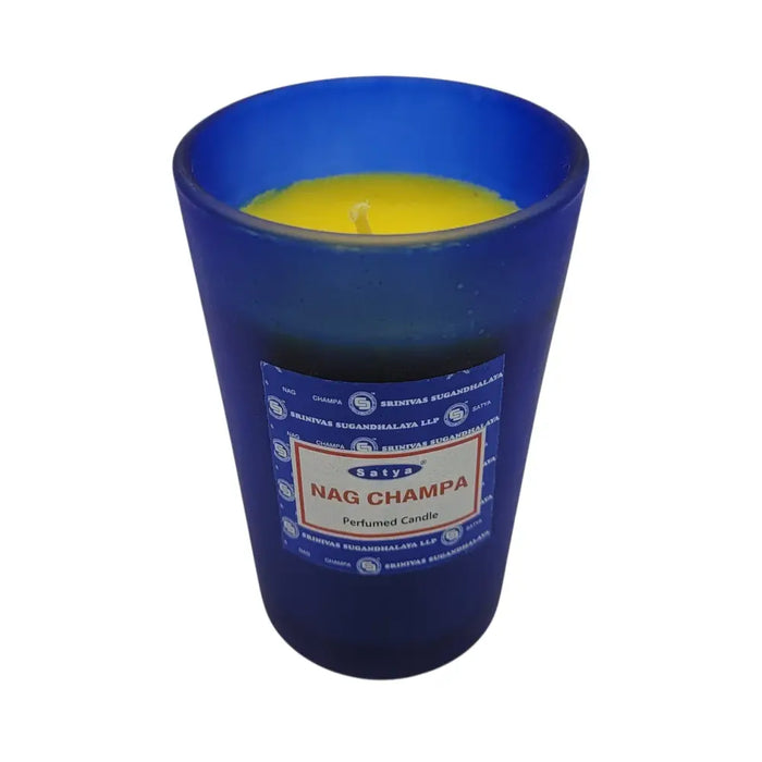 Satya nag champa scented candle in a yellow wax blue glass jar with a branded label and nag champa scent