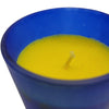 A vibrant yellow SATYA nag champa scented candle inside a translucent blue glass jar holder