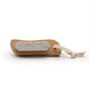 Beige wooden scrub and scrape brush with textured light gray stone surface and rope loop for foot care