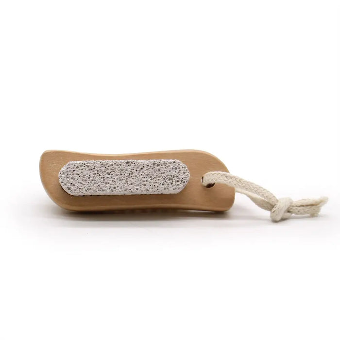 Beige wooden scrub and scrape brush with textured light gray stone surface and rope loop for foot care