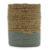 A cylindrical woven vase with beige and gray braided seagrass and raffia fibers in a set with bins