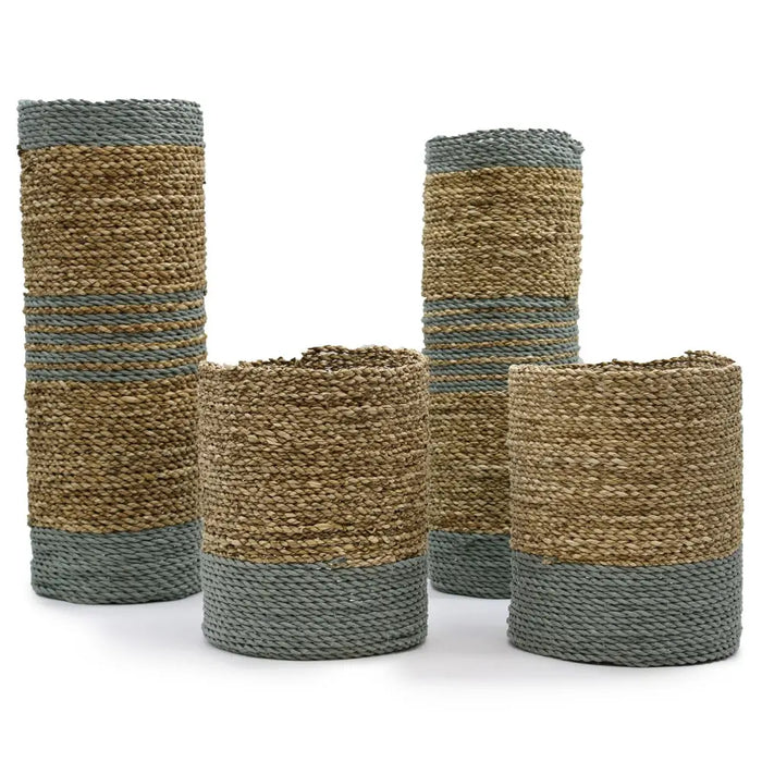 Set of four woven seagrass and abu-abu raffia vases and bins in natural beige and muted gray stripes cylindrical shape