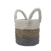 A seagrass basket with two handles in grey natural and white stripes from a set of three woven baskets
