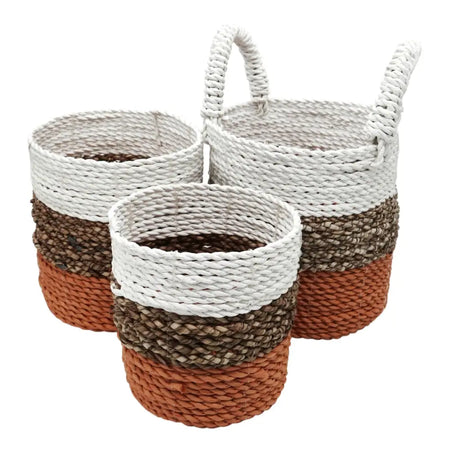 Set of three seagrass woven baskets with orange, natural, and white color bands and braided handles