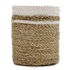 A cylindrical beige seagrass basket with two white stripes from the seagrass set featuring vases and bins