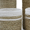 Natural fiber seagrass basket with beige body and white braided trim from seagrass set with vases and bins