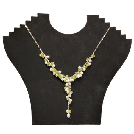 Seed pearl and gemstone chip necklace with silver chain featuring pale green peridot and creamy white pearls in v-shape