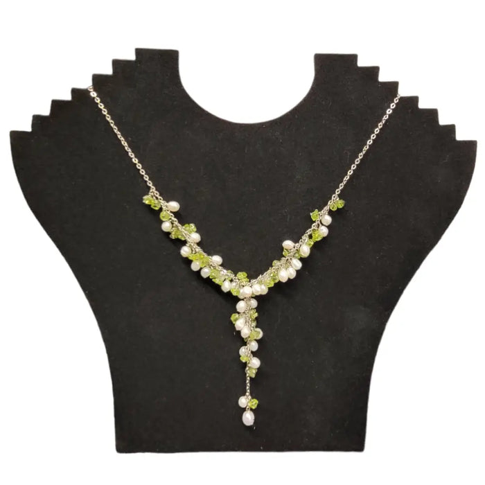 Seed pearl and gemstone chip necklace with silver chain featuring pale green peridot and creamy white pearls in v-shape