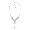 A delicate silver chain necklace with cascading white freshwater seed pearls and clear gemstone chip crystals in a v shape