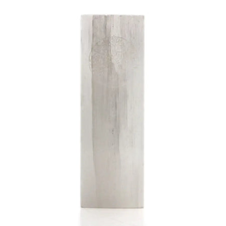 A tall slender selenite block lamp with a light gray wood grain texture in a rectangular shape called tree of life
