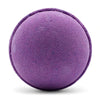 A round textured purple bath bomb with subtle speckles from a set of 3 bath bombs blackberry scent