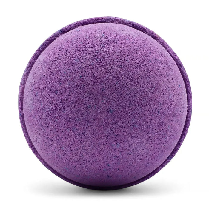 A round textured purple bath bomb with subtle speckles from a set of 3 bath bombs blackberry scent