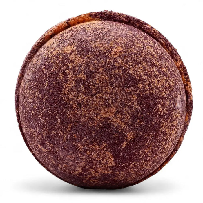 A round textured bath bomb in maroon and brown speckles from a set of 3 bath bombs chocolate and orange