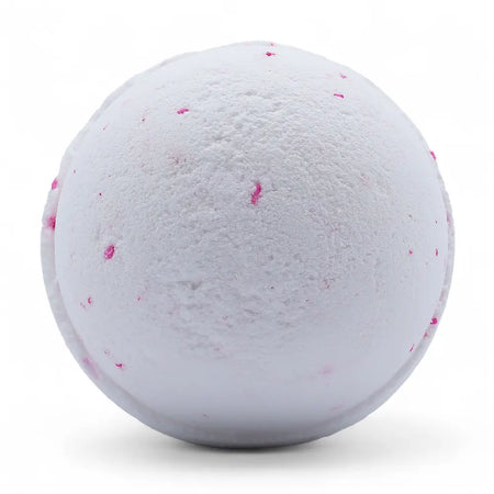 A white bath bomb with pink speckles from a set of 3 bath bombs coconut dream for a relaxing bath experience