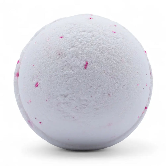 A white bath bomb with pink speckles from a set of 3 bath bombs coconut dream for a relaxing bath experience