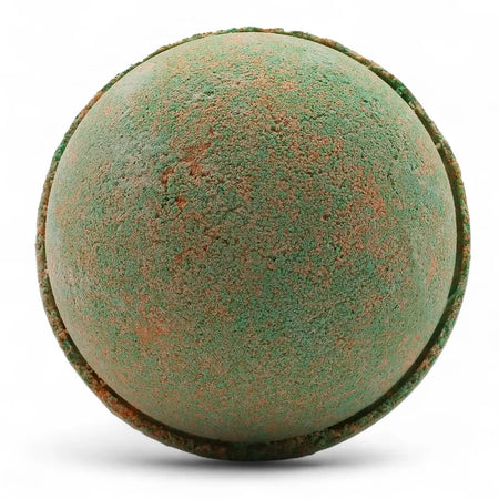 A round textured bath bomb with green and rust colors from a set of 3 bath bombs hawaiian mango