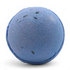 A round blue bath bomb with dried lavender flecks and a textured surface from a set of 3 bath bombs lavender seeds