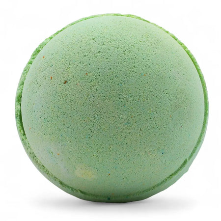 A round light green bath bomb with textured surface and darker green speckles from a lemon eucalyptus set