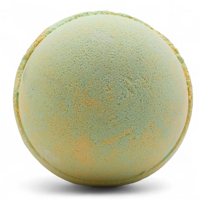 A round textured bath bomb in soft mint green and pale yellow from a set of 3 bath bombs melon