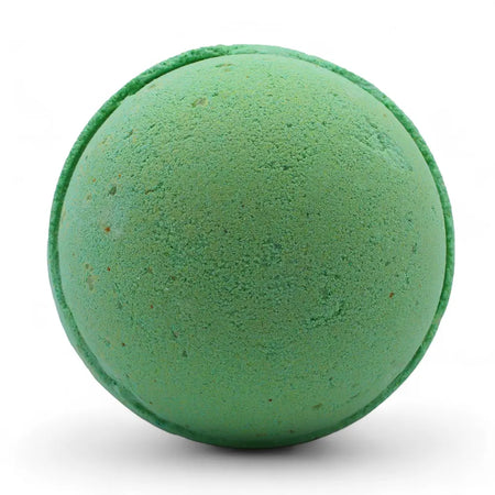 A round green bath bomb with a textured surface and speckles from a set of 3 peppermint and tea tree bath bombs