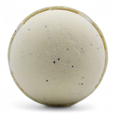 Cream-colored simply vanilla bath bomb with a textured surface and small black speckles in a set of 3 bath bombs